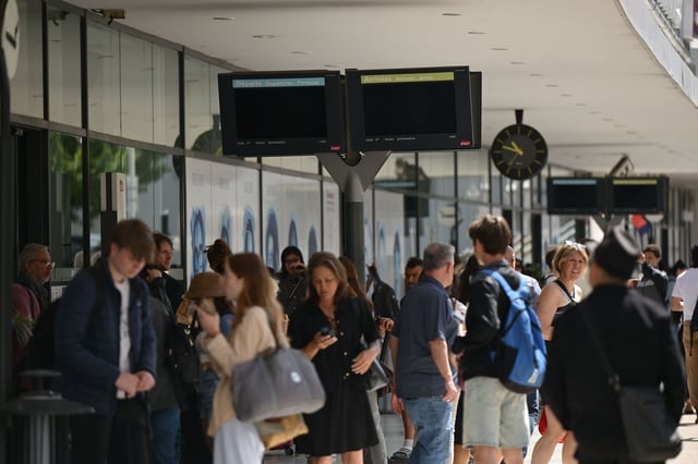 People waiting at a station after a significant power outage was reported by local authorities in Alpes-Maritimes in France on May 24, 2025.