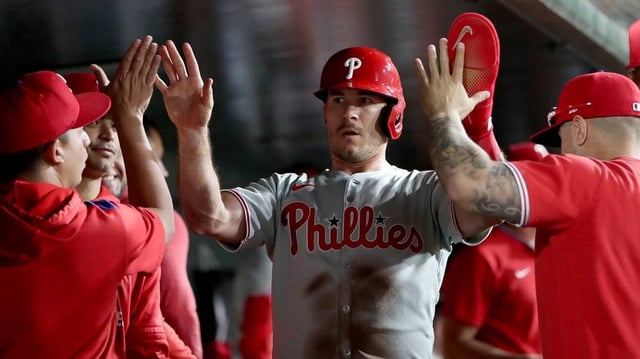May 23, 2025; West Sacramento, California, USA; Philadelphia Phillies catcher J.T. Realmuto (10) is congratulated by teammates after scoring a run against the Athletics during the ninth inning at Sutter Health Park. Mandatory Credit: Dennis Lee-Imagn Images