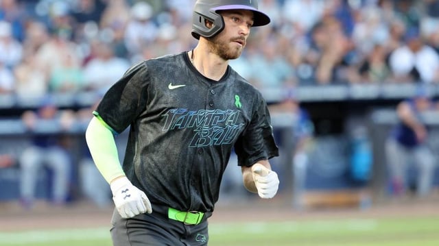 May 23, 2025; St. Petersburg, Florida, USA;  Tampa Bay Rays second base Brandon Lowe (8) hits a home run during the third inning against the Toronto Blue Jays at George M. Steinbrenner Field. Mandatory Credit: Kim Klement Neitzel-Imagn Images