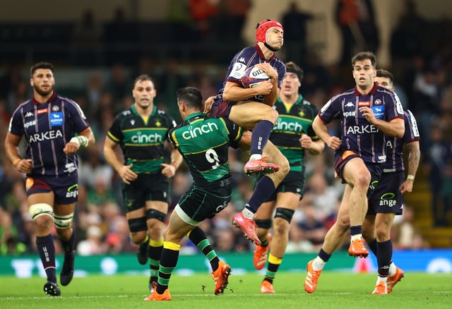 Rugby Union - European Challenge Cup Final - Northampton Saints v Bordeaux Begles - Principality Stadium, Cardiff, Wales, Britain - May 24, 2025 Bordeaux Begles' Louis Bielle-Biarrey in action with Northampton Saints' Alex Mitchell Action Images via Reuters/Andrew Boyers