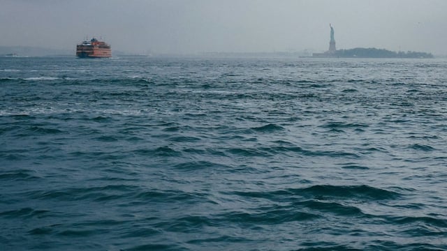 An explosion on a barge near West 138th Street in NYC left one worker fighting for life and another rescued.