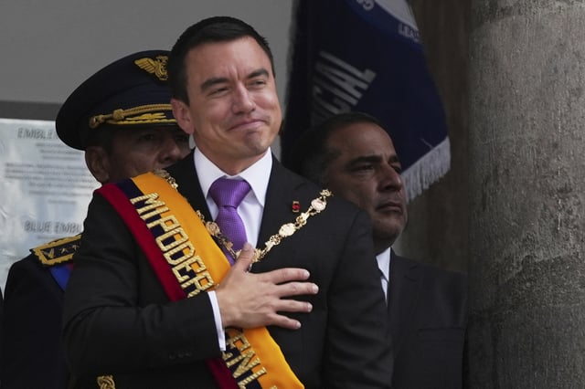 Ecuador's President Daniel Noboa acknowledges supporters from the balcony of the presidential palace after his swearing-in ceremony for a second term in Quito, Ecuador, Saturday, May 24, 2025. (AP Photo/Carlos Noriega)