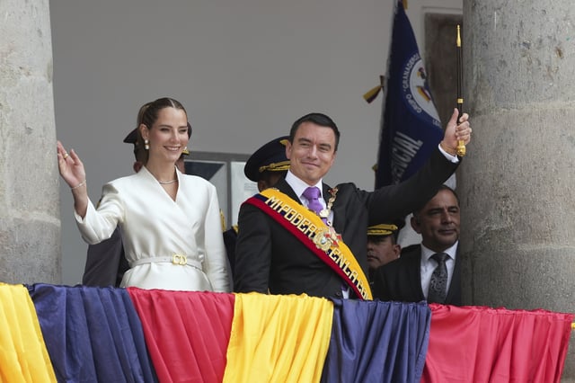 Ecuador's President Daniel Noboai and his wife, Lavinia Valbonesi, wave from the balcony of the presidential palace after his swearing-in ceremony for a second term in Quito, Ecuador, Saturday, May 24, 2025. (AP Photo/Carlos Noriega)