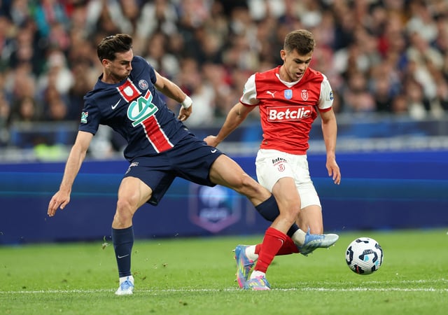 Soccer Football - Coupe de France - Final - Paris St Germain v Stade de Reims - Stade de France, Saint-Denis, France - May 24, 2025 Paris St Germain's Fabian Ruiz in action with Stade de Reims' Gabriel Moscardo REUTERS/Denis Balibouse