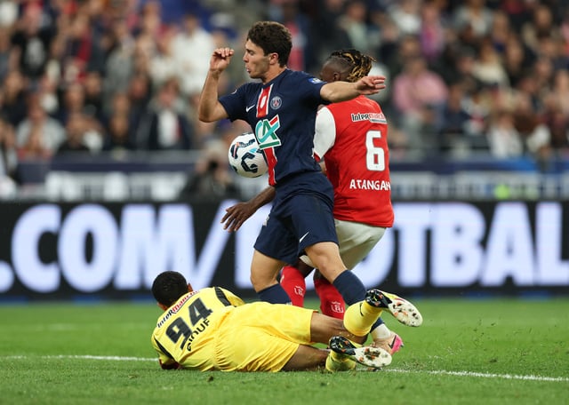 Soccer Football - Coupe de France - Final - Paris St Germain v Stade de Reims - Stade de France, Saint-Denis, France - May 24, 2025 Paris St Germain's Joao Neves in action with Stade de Reims' Yehvann Diouf and Valentin Atangana Edoa REUTERS/Denis Balibouse