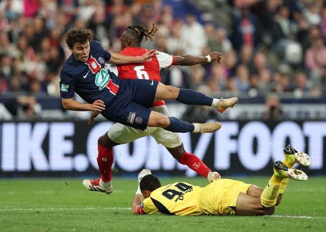Soccer Football - Coupe de France - Final - Paris St Germain v Stade de Reims - Stade de France, Saint-Denis, France - May 24, 2025 Paris St Germain's Joao Neves in action with Stade de Reims' Yehvann Diouf and Valentin Atangana Edoa REUTERS/Denis Balibouse
