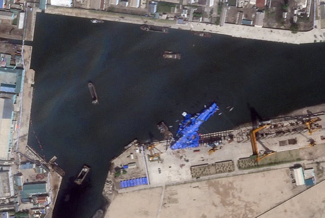 A satellite image shows a North Korean warship covered with a blue tarp after an accident that occurred during its launch at the shipyard in Chongjin, North Korea, May 23, 2025. 2025 Planet Labs PBC/Handout via REUTERS THIS IMAGE HAS BEEN SUPPLIED BY A THIRD PARTY. MANDATORY CREDIT
