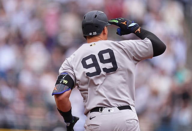 New York Yankees&#39; Aaron Judge gestures to the bullpen as he circles the bases after hitting a solo home run off Colorado Rockies starting pitcher Kyle Freeland in the first inning of a baseball game Saturday, May 24, 2025, in Denver. (AP Photo/David Zalubowski)