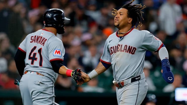 The Cleveland Guardians’ Jose Ramirez celebrates with Carlos Santana (41) after scoring to take a 4-3 lead against the Detroit Tigers during the 10th inning at Comerica Park on Saturday, May 24, 2025, in Detroit. (Duane Burleson/Getty Images/TNS)