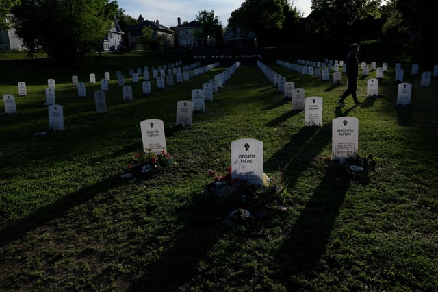 Laurie Reemeyer, visiting from Canada, walks amongst the names in ‘Say Their Names Cemetery’ ahead of the fifth anniversary of the murder of George Floyd by former police officer Derek Chauvin in Minneapolis, Minnesota, U.S., May 23, 2025. REUTERS/Leah Millis     TPX IMAGES OF THE DAY