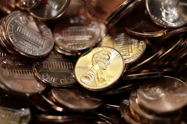 Freshly-made pennies sit in a bin at the US Mint in Denver in this 2007 file photo.