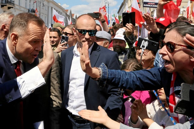 Karol Nawrocki, presidential candidate supported by the main opposition party Law and Justice (PiS), attends a march with his supporters ahead of the second round of presidential elections, in Warsaw, Poland May 25, 2025. Agencja Wyborcza.pl/Robert Kowalewski via REUTERS   ATTENTION EDITORS - THIS IMAGE WAS PROVIDED BY A THIRD PARTY. POLAND OUT. NO COMMERCIAL OR EDITORIAL SALES IN POLAND.     TPX IMAGES OF THE DAY