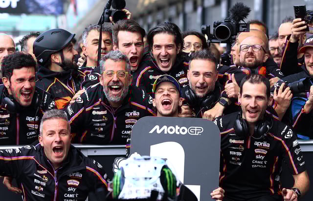 MotoGP - British Grand Prix - Silverstone Circuit, Silverstone, Britain - May 25, 2025 Aprilia Racing's Marco Bezzecchi celebrates with his team after winning the MotoGP race Action Images via Reuters/Andrew Boyers