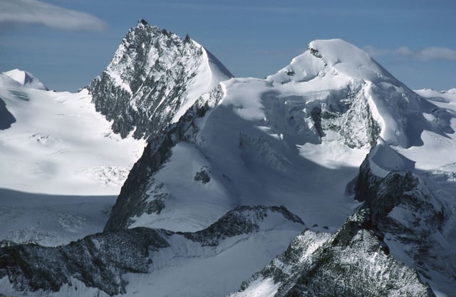 The snow-capped peaks of Rimpfischhorn (left) and Allalinhorn in the Valais Alps, Switzerland.