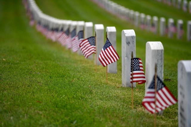 Boy Scouts with the Western Los Angeles County Boys Scouts of America Council, help place flags on nearly 90,000 grave sites for Memorial Day at the Los Angeles National Cemetery on Saturday, May 25, 2024. 
(Photo by Axel Koester, Contributing Photographer)