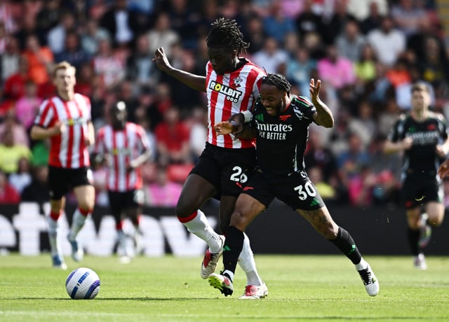 Soccer Football - Premier League - Southampton v Arsenal - St Mary's Stadium, Southampton, Britain - May 25, 2025 Arsenal's Raheem Sterling in action with Southampton's Lesley Ugochukwu REUTERS/Dylan Martinez