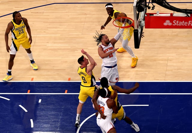 Jalen Brunson #11 of the New York Knicks makes a layup past T.J. McConnell #9 of the Indiana Pacers during the first quarter in Game One of the Eastern Conference Finals of the 2025 NBA Playoffs at Madison Square Garden on May 21, 2025 in New York City.
