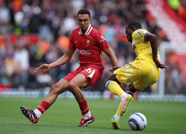Soccer Football - Premier League - Liverpool v Crystal Palace - Anfield, Liverpool, Britain - May 25, 2025 Liverpool's Trent Alexander-Arnold in action with Crystal Palace's Tyrick Mitchell REUTERS/Phil Noble