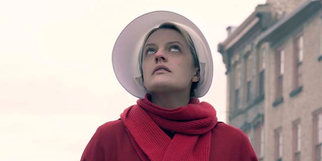 Elisabeth Moss looking up to the sky in The Handmaid's Tale.