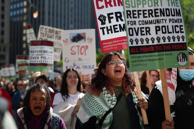 Esmeralda Garcia chants with other protesters as they stand across the Chicago River from Trump Tower after a Chicago Alliance Against Racist and Political Repression demonstration at Federal Plaza on May 25, 2025. (Eileen T. Meslar/Chicago Tribune)