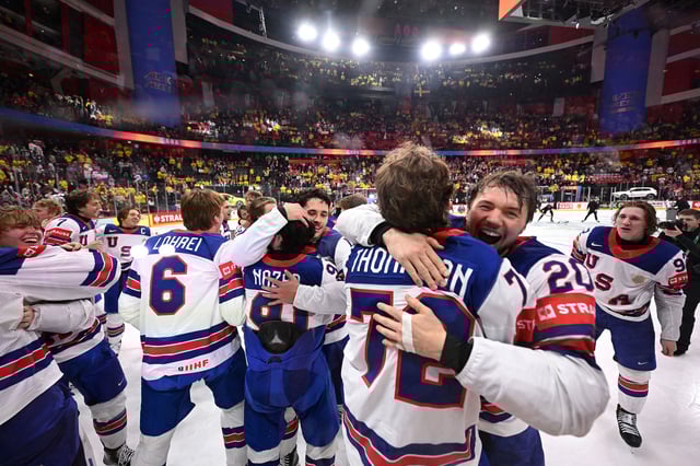 US players celebrate after winning the IIHF Men's Ice Hockey World Championship final match between Switzerland and USA in Stockholm, on May 25, 2025.