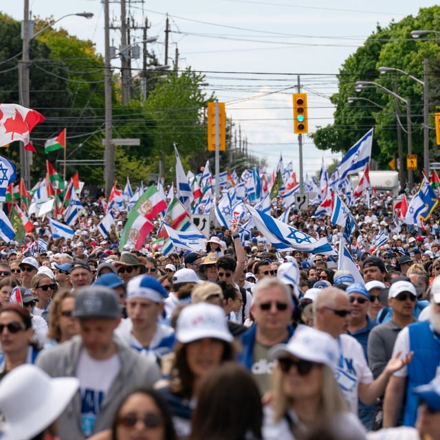 People participate in the United Jewish Appeal's annual Walk With Israel march in Toronto on Sunday, May 25, 2025. THE CANADIAN PRESS/Arlyn McAdorey