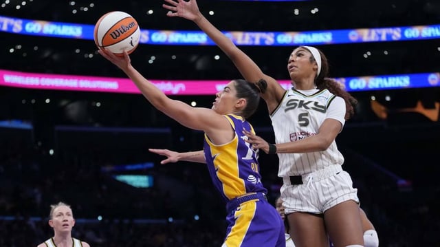 LA Sparks guard Kelsey Plum (10) shoots the ball against Chicago Sky forward Angel Reese (5) in the first half at Crypto.com Arena.