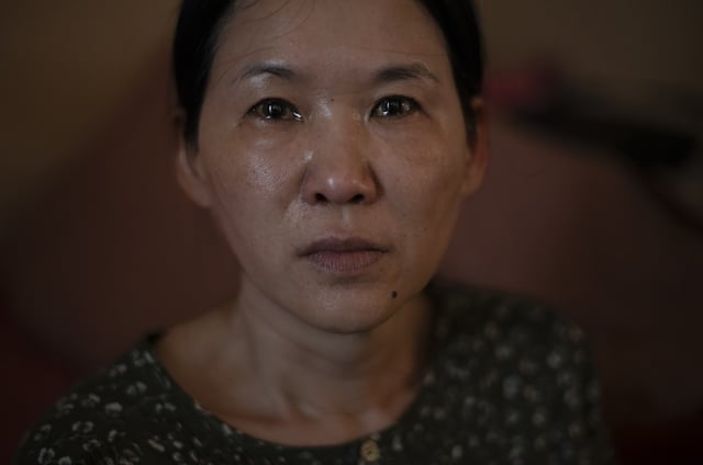 FILE - Yooree Kim, who was 11 when she was sent by an adoption agency to a couple in France, sits for a portrait as tears well up in her eyes in her apartment in Seoul, South Korea, Sunday, May 19, 2024. (AP Photo/Jae C. Hong, File)