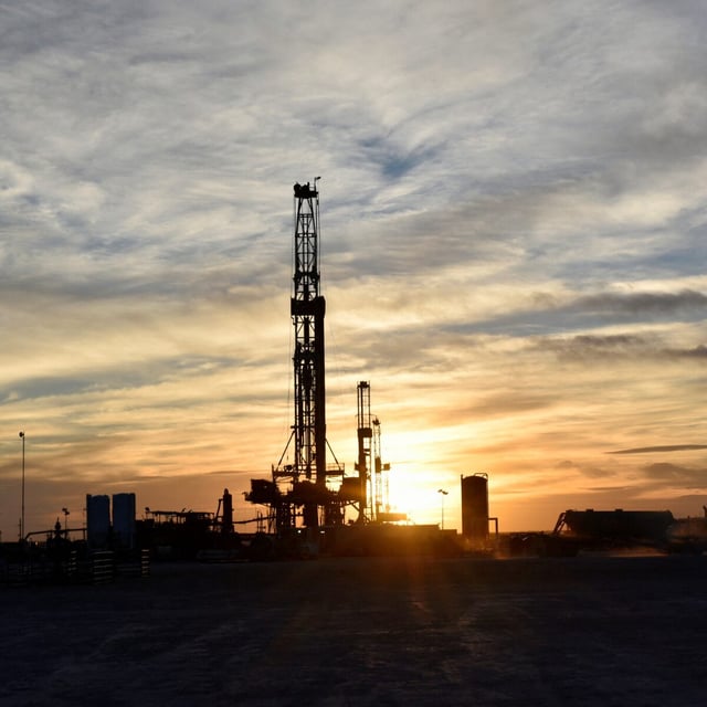 FILE PHOTO: Drilling rigs operate at sunset in Midland, Texas, U.S., February 13, 2019. Picture taken February 13, 2019. REUTERS/Nick Oxford/File Photo