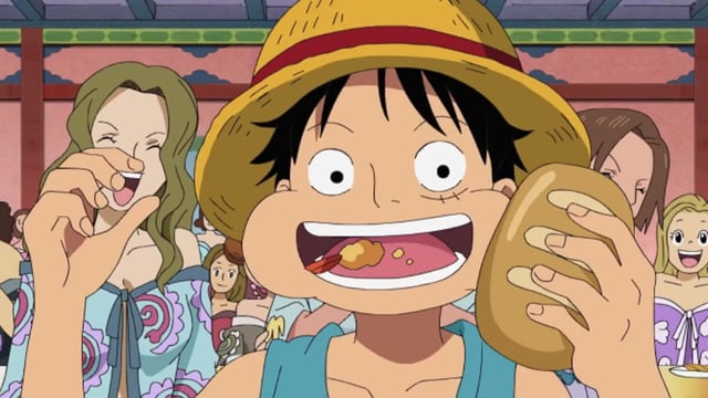 Luffy eating a bread roll with his mouth open