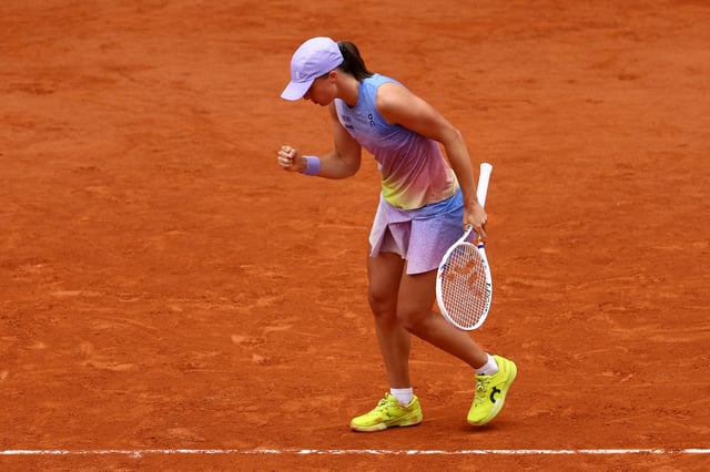 Tennis - French Open - Roland Garros, Paris, France - May 26, 2025 Poland's Iga Swiatek reacts during her first round match against Slovakia's Rebecca Sramkova REUTERS/Lisi Niesner