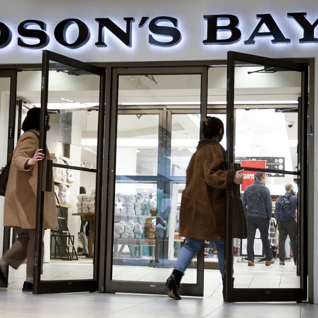 Shoppers enter the Hudson's Bay store in downtown Calgary, Alta., Thursday, March 20, 2025. THE CANADIAN PRESS/Jeff McIntosh