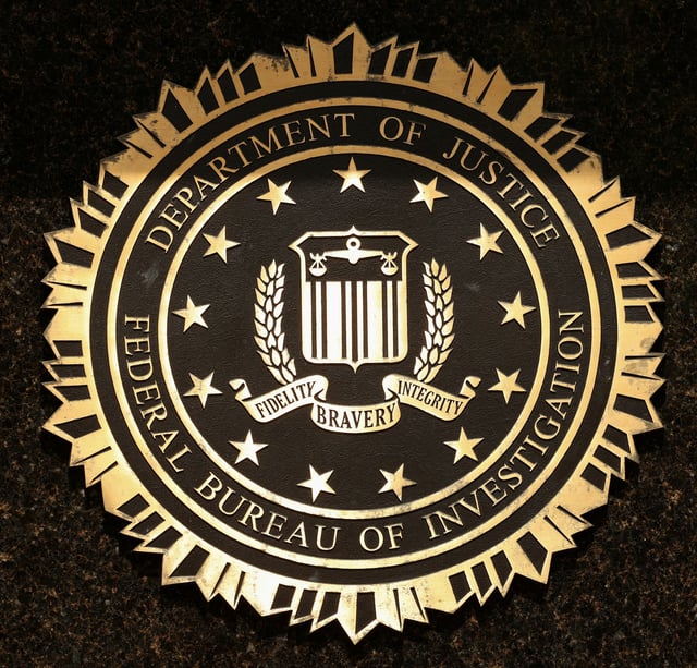 A view shows the Federal Bureau of Investigation seal on the J. Edgar Hoover Building on the day that FBI Director Kash Patel announced that he’s redeploying 1,500 FBI agents and shutting down the bureau’s storied headquarters, in Washington, D.C., U.S., May 16, 2025. REUTERS/Kevin Lamarque/File Photo