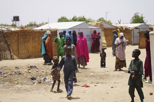 Women and children displaced by Boko haram attacks are seen outside there camp in Dikwa, north east Nigeria, April 29, 2025. (AP Photo/Sunday Alamba)