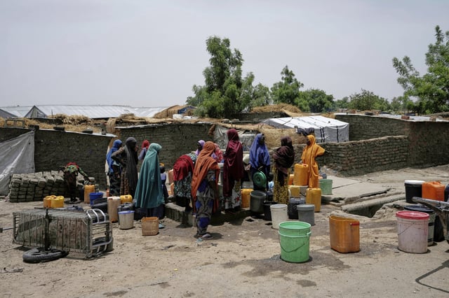 FILE- Women displaced from Boko Haram attacks fetch water from a borehole in Dikwa, north east Nigeria, April 29, 2025. (AP Photo/Sunday Alamba, File)