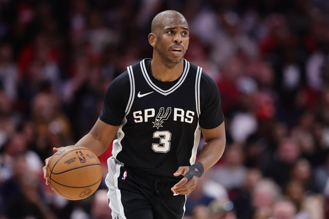 Chris Paul #3 of the San Antonio Spurs handles the ball against the Houston Rockets during the second half at Toyota Center on February 26, 2025 in Houston, Texas.