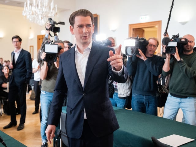 Photographers take pictures of Austria's former Chancellor Sebastian Kurz as he arrives at court for the hearing of his appeal against his conviction for giving false testimony, on May 26, 2025 in Vienna, Austria. Once hailed as the "wunderkind" of Europe's conservatives, Kurz resigned as chancellor in 2021 amid a series of accusations. He was found guilty in 2024 of giving false testimony to a parliamentary inquiry and handed an eight-month suspended jail sentence. (Photo by GEORG HOCHMUTH / APA / AFP) / Austria OUT (Photo by GEORG HOCHMUTH/APA/AFP via Getty Images)
