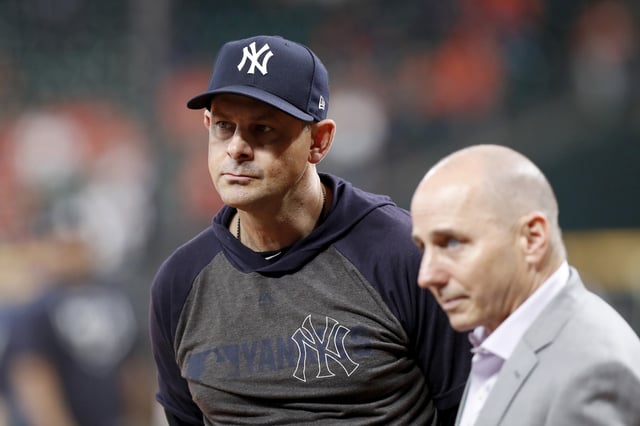 HOUSTON, TX - OCTOBER 13: Manager Aaron Boone #17 of the New York Yankees watches batting practice before game two of the American League Championship Series against the Houston Astros at Minute Maid Park on October 13, 2019 in Houston, Texas.