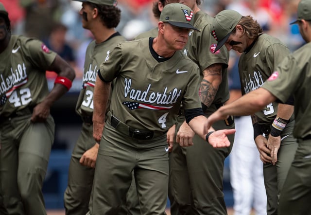 Vanderbilt coach Tim Corbin (4) shakes hands with his players during introductions before his team plays Mississippi in the SEC baseball tournament championship game at Hoover Met in Birmingham, Ala., on Sunday, May 25, 2025.