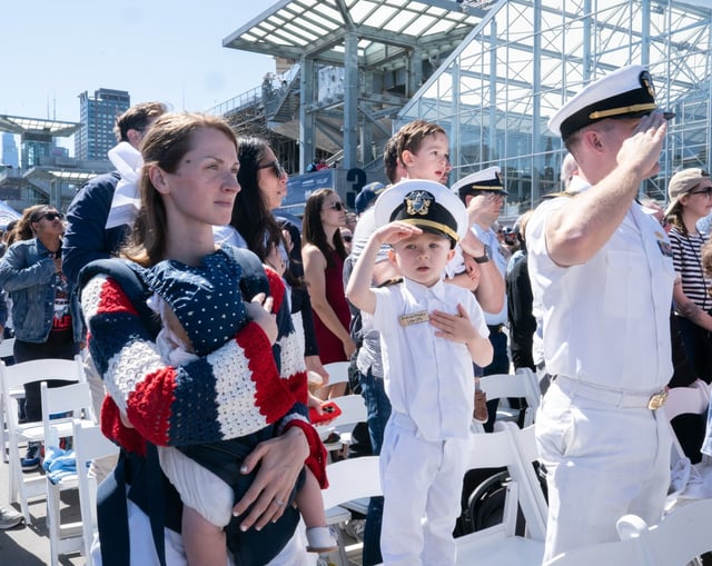 Lt. Commander Blake Pauley, his wife Lindsey Pauley and their children Emerson Pauley, 4, and Eowyn Pauley, 9 mos., stand during the annual Memorial Day Ceremony at the Intrepid Museum Monday, May 26, 2025 in Manhattan, New York. (Barry Williams/ New York Daily News)