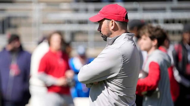 Ohio State Buckeye head coach Ryan Day watches his team warm up before the start of the spring game at Ohio Stadium on April 12, 2025.