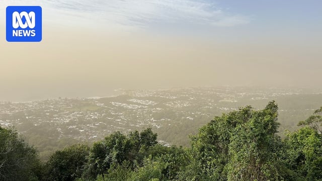 A dust sky horizon on a high point with sea in the background.