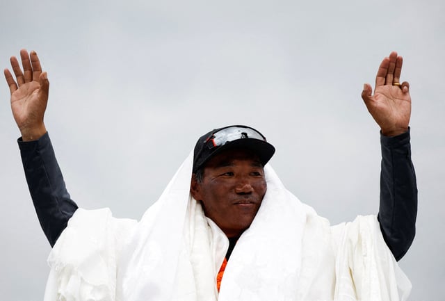 Kami Rita Sherpa, 53, a Nepali mountaineer, waves towards the media personnel upon his arrival after climbing Mount Everest for the 28th time, creating a new record for the most summits of the world’s highest mountain, in Kathmandu, Nepal May 25, 2023. REUTERS/Navesh Chitrakar/File Photo