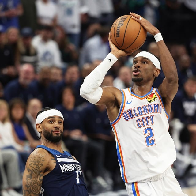 Oklahoma City Thunder guard Shai Gilgeous-Alexander (2) shoots against Minnesota Timberwolves guard Nickeil Alexander-Walker during the second half of Game 4 of the Western Conference finals of the NBA basketball playoffs Monday, May 26, 2025, in Minneapolis. (AP Photo/Matt Krohn)