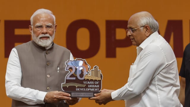 Gandhinagar: Prime Minister Narendra Modi being presented a memento by Gujarat chief minister Bhupendra Patel during an event.