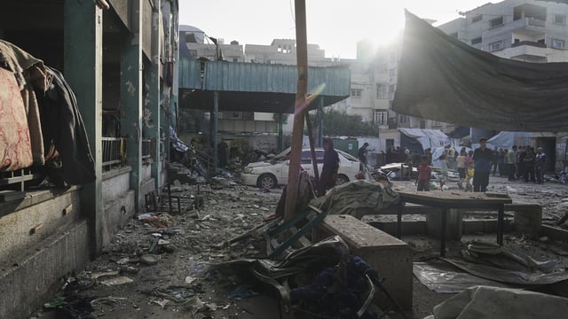 Palestinians inspect the damage at school used as a shelter by displaced residents that was hit by Israeli military strike and killed at least 36 people, in Gaza City, on Monday, May 26, 2025. AP/PTI(AP05_26_2025_000199B)