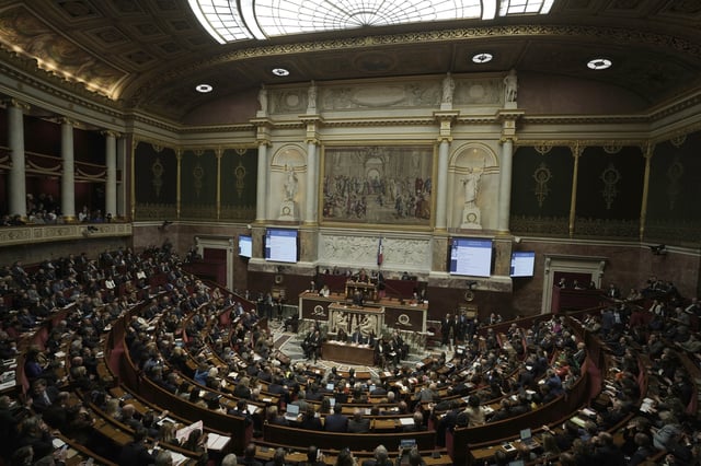 FILE - Lawmakers listen to French Prime Minister Francois Bayrou delivering his general policy speech, Jan. 14, 2025 at the National Assembly in Paris. (AP Photo/Thibault Camus, file)