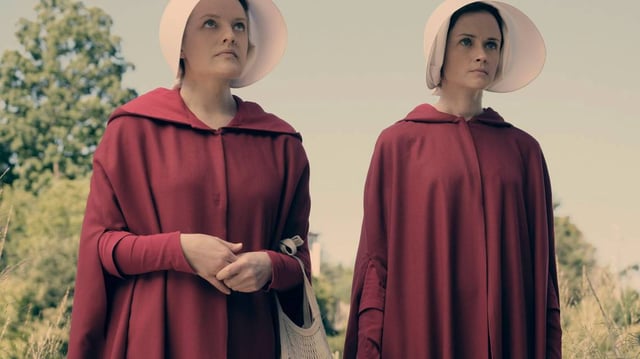 THE HANDMAID’S TALE, (from left): Elisabeth Moss, Alexis Bledel, ‘Offred’, (Season 1, ep. 101, aired April 26, 2017). photo: George Kraychyk / ©Hulu / Courtesy: Everett Collection