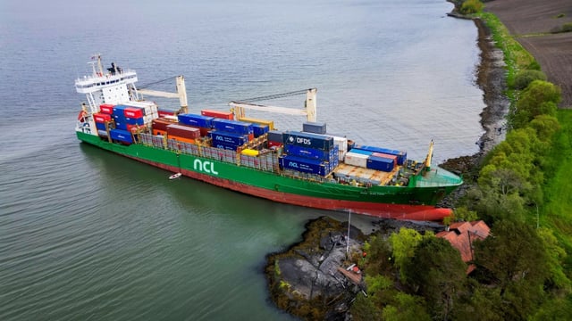 A cargo ship has been freed after running aground near  a house in Norway