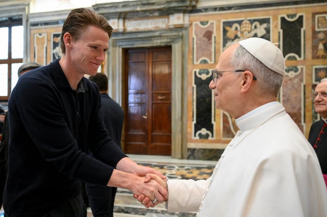 Pope Leo XIV meets with Napoli player Scott McTominay after Serie A title victory, at the Vatican, May 27, 2025.    Simone Risoluti/Vatican Media/­Handout via REUTERS